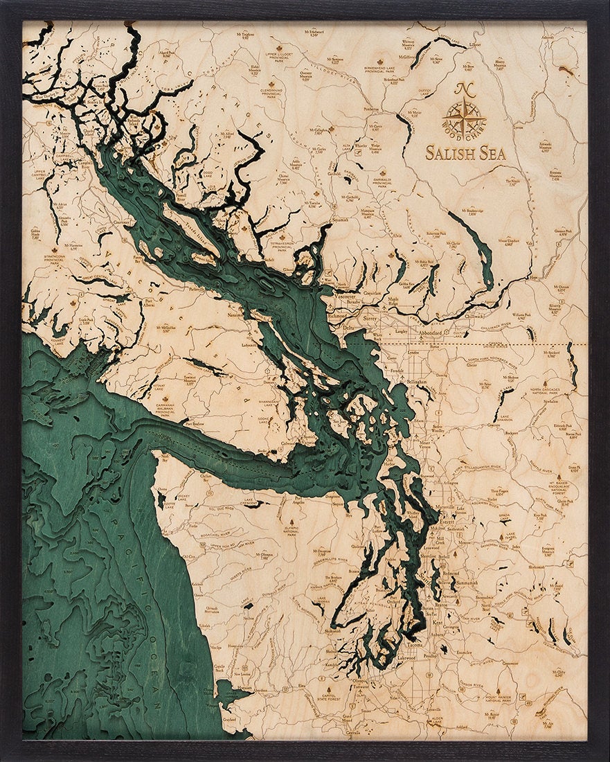 Salish Sea, Washington 3D layered wood map in laser-cut Baltic birch, shown framed against a light wall