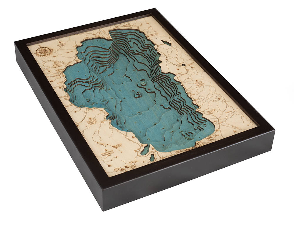 Lake Tahoe, California 3D layered wood map in laser-cut Baltic birch, shown framed against a light wall