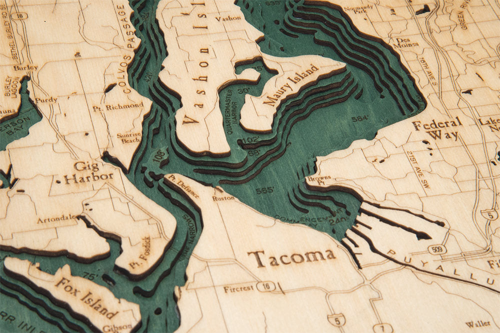 Puget Sound, Washington 3D layered wood map in laser-cut Baltic birch, shown framed against a light wall