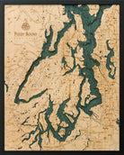Puget Sound, Washington 3D layered wood map in laser-cut Baltic birch, shown framed against a light wall