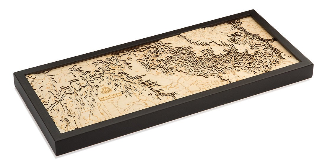 Grand Canyon, Arizona 3D layered wood map in laser-cut Baltic birch, shown framed against a light wall