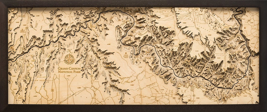 Grand Canyon, Arizona 3D layered wood map in laser-cut Baltic birch, shown framed against a light wall