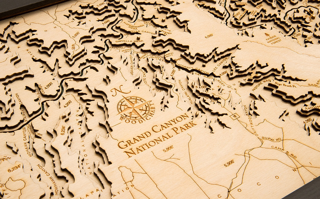 Grand Canyon, Arizona 3D layered wood map in laser-cut Baltic birch, shown framed against a light wall