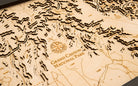 Grand Canyon, Arizona 3D layered wood map in laser-cut Baltic birch, shown framed against a light wall