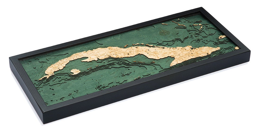 Cuba 3D layered wood map in laser-cut Baltic birch, shown framed against a light wall