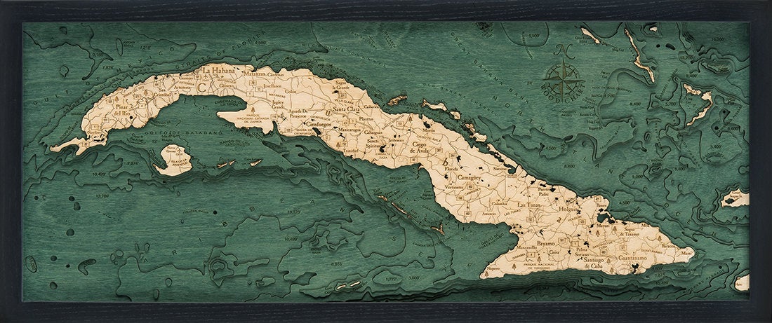Cuba 3D layered wood map in laser-cut Baltic birch, shown framed against a light wall