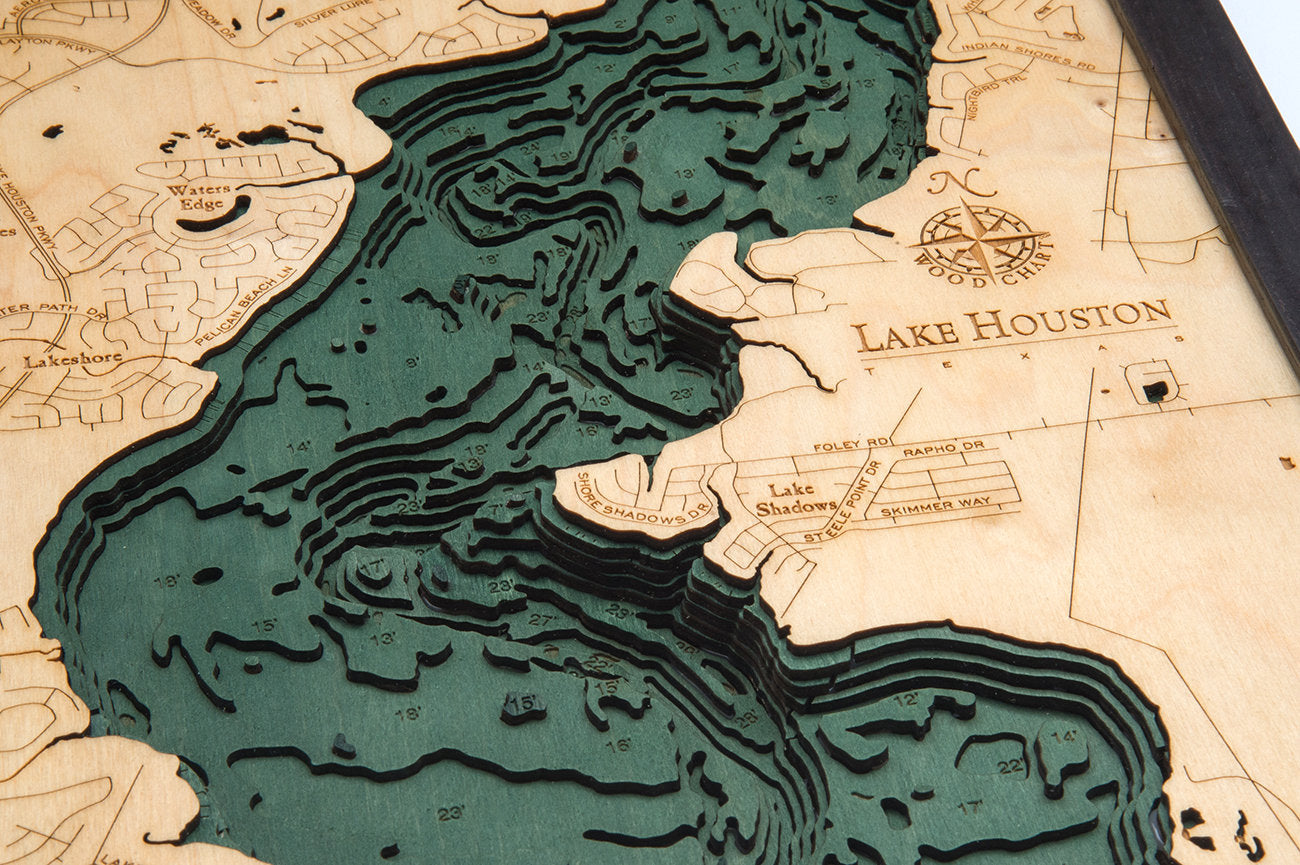 Lake Houston, Texas 3D layered wood map in laser-cut Baltic birch, shown framed against a light wall