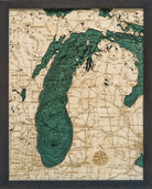 Lake Michigan 3D layered wood map in laser-cut Baltic birch, shown framed against a light wall