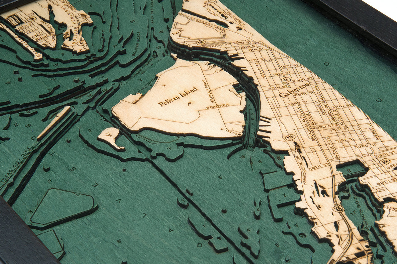 Galveston, Texas 3D layered wood map in laser-cut Baltic birch, shown framed against a light wall