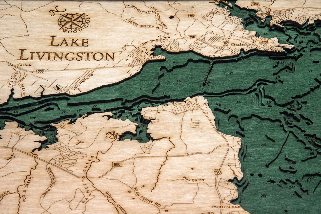 Lake Livingston, Texas 3D layered wood map in laser-cut Baltic birch, shown framed against a light wall