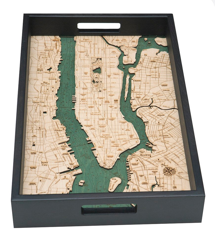 Manhattan, New York wood serving tray in laser-cut Baltic birch, shown framed against a light wall