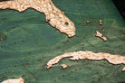Gulf Of Mexico wood serving tray in laser-cut Baltic birch, shown framed against a light wall
