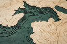 Lake Arrowhead, California 3D layered wood map in laser-cut Baltic birch, shown framed against a light wall