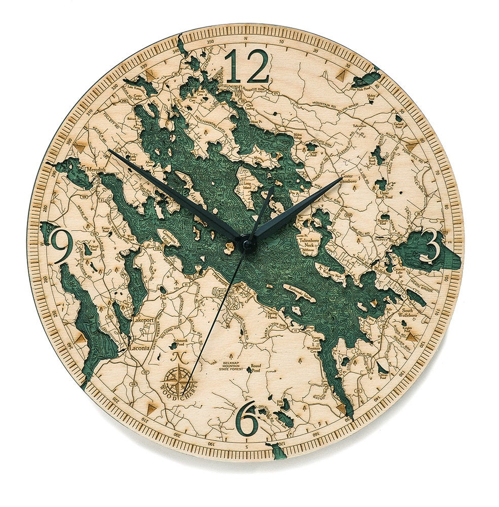 Lake Winnipesaukee, New Hampshire wood wall clock in laser-cut Baltic birch, shown framed against a light wall