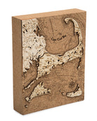 Cape Cod, Massachusetts framed cork map in laser-cut Baltic birch, shown framed against a light wall