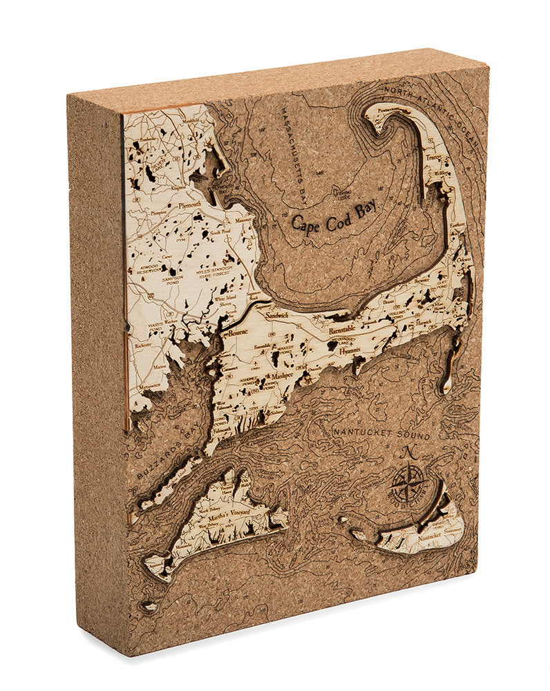 Cape Cod, Massachusetts framed cork map in laser-cut Baltic birch, shown framed against a light wall