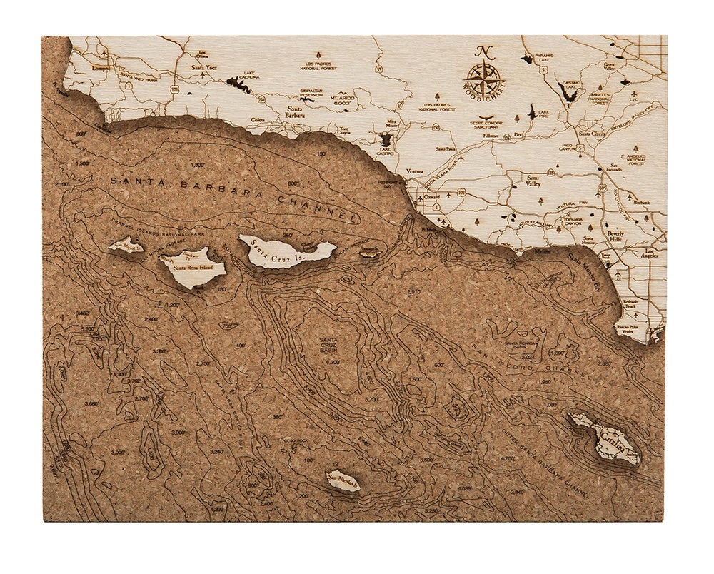 Santa Barbara, California framed cork map in laser-cut Baltic birch, shown framed against a light wall