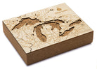 Great Lakes framed cork map in laser-cut Baltic birch, shown framed against a light wall