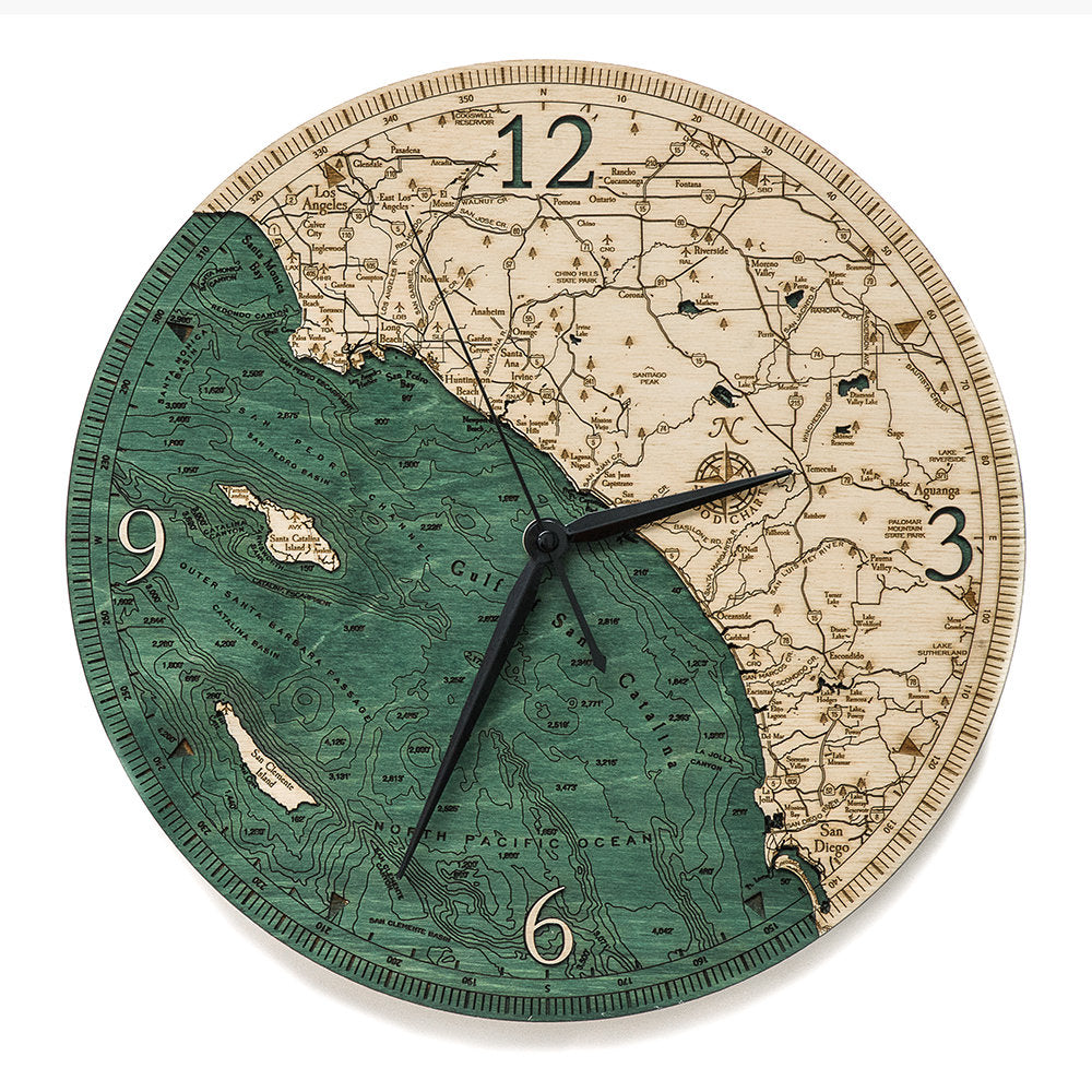 LA to San Diego, California wood wall clock in laser-cut Baltic birch, shown framed against a light wall
