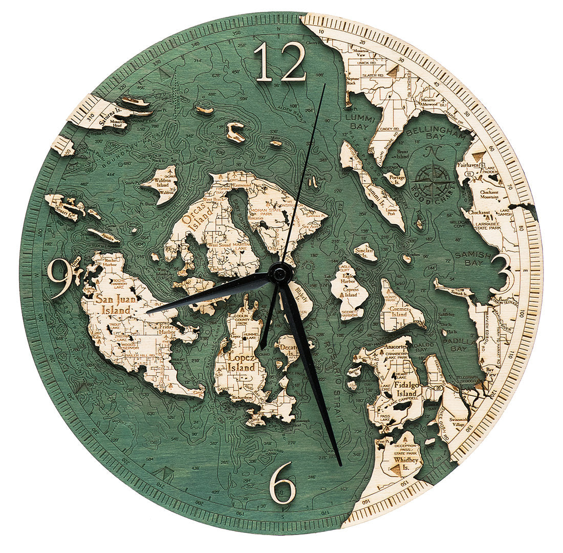 San Juan Islands, Washington wood wall clock in laser-cut Baltic birch, shown framed against a light wall