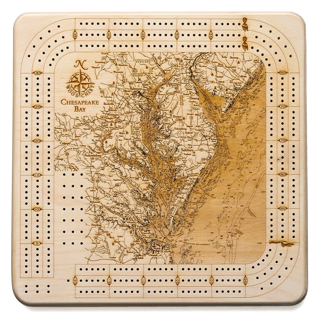 Chesapeake Bay, Maryland wood cribbage board in laser-cut Baltic birch, shown framed against a light wall