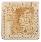 Lake Michigan wood cribbage board in laser-cut Baltic birch, shown framed against a light wall