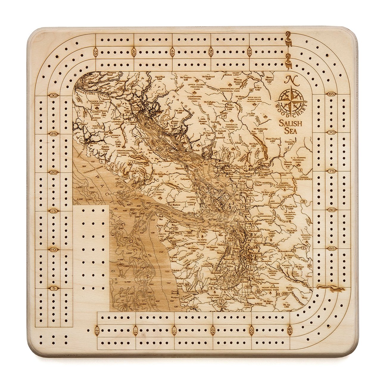 Salish Sea, Washington wood cribbage board in laser-cut Baltic birch, shown framed against a light wall