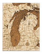 Lake Michigan framed cork map in laser-cut Baltic birch, shown framed against a light wall