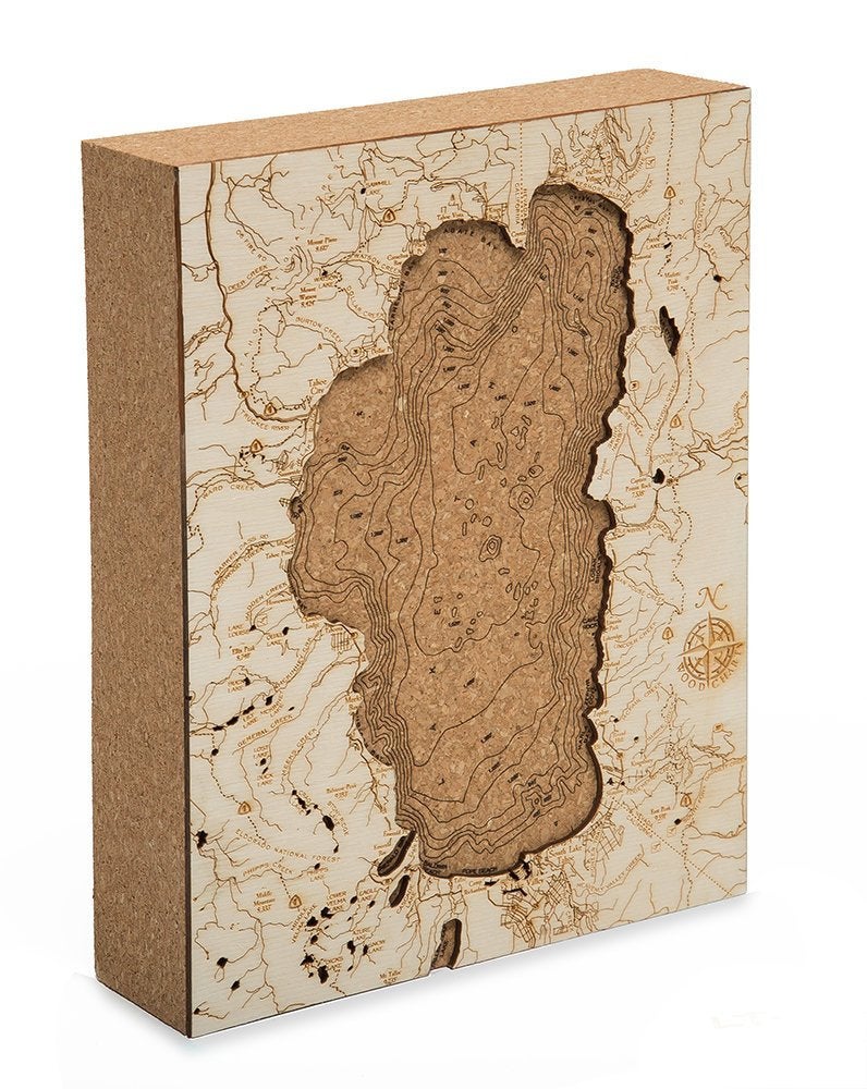 Lake Tahoe, California framed cork map in laser-cut Baltic birch, shown framed against a light wall
