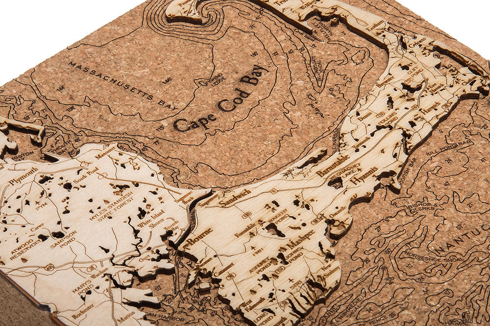 Cape Cod, Massachusetts framed cork map in laser-cut Baltic birch, shown framed against a light wall