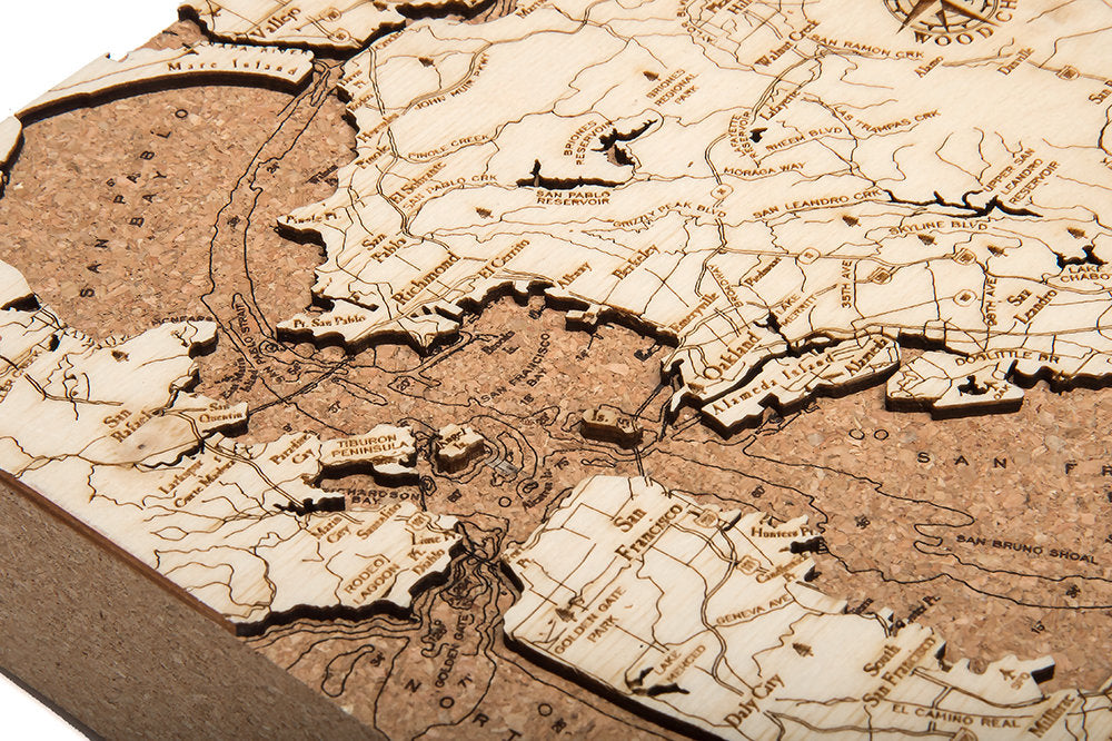 San Francisco, California framed cork map in laser-cut Baltic birch, shown framed against a light wall
