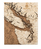 Salish Sea, Washington framed cork map in laser-cut Baltic birch, shown framed against a light wall