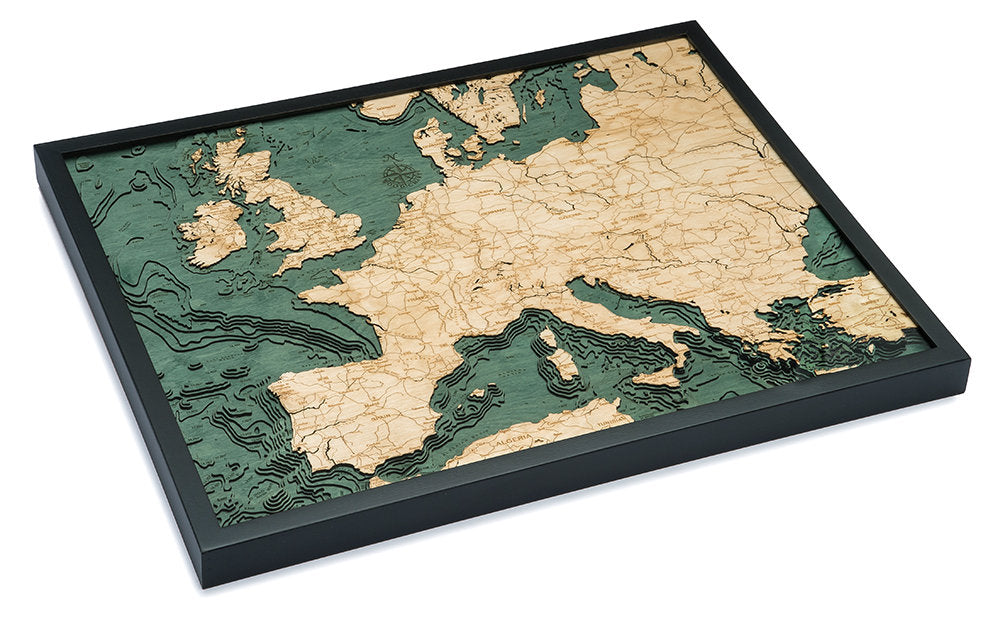 Western Europe 3D layered wood map in laser-cut Baltic birch, shown framed against a light wall