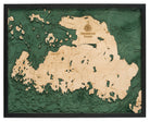 Drummond Island, Michigan 3D layered wood map in laser-cut Baltic birch, shown framed against a light wall