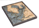 Tampa Bay, Florida 3D layered wood map in laser-cut Baltic birch, shown framed against a light wall