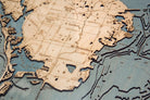 Tampa Bay, Florida 3D layered wood map in laser-cut Baltic birch, shown framed against a light wall