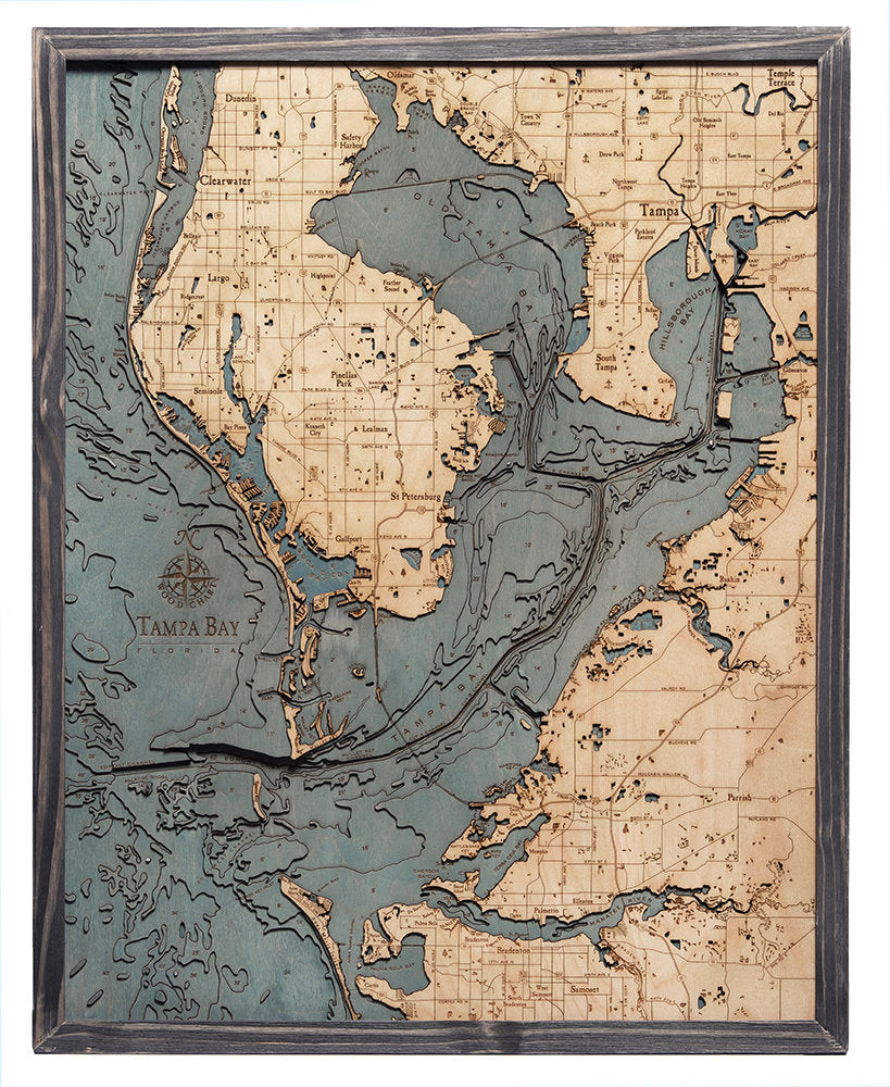Tampa Bay, Florida 3D layered wood map in laser-cut Baltic birch, shown framed against a light wall