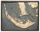Sanibel Island, Florida 3D layered wood map in laser-cut Baltic birch, shown framed against a light wall