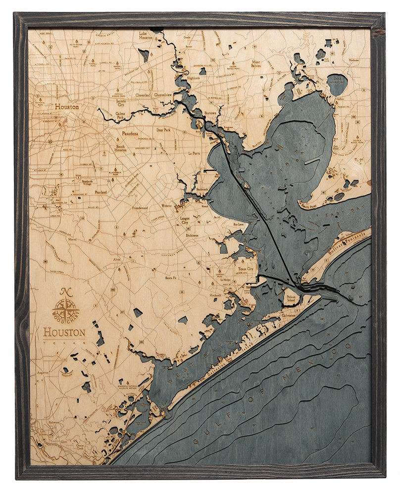 Houston, Texas 3D layered wood map in laser-cut Baltic birch, shown framed against a light wall