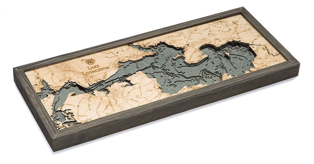 Lake Livingston, Texas 3D layered wood map in laser-cut Baltic birch, shown framed against a light wall