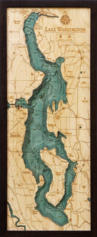 Lake Washington 3D layered wood map in laser-cut Baltic birch, shown framed against a light wall