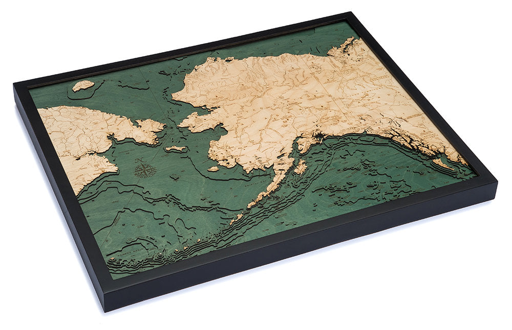 Alaska 3D layered wood map in laser-cut Baltic birch, shown framed against a light wall