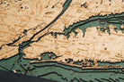 Long Island Sound 3D layered wood map in laser-cut Baltic birch, shown framed against a light wall