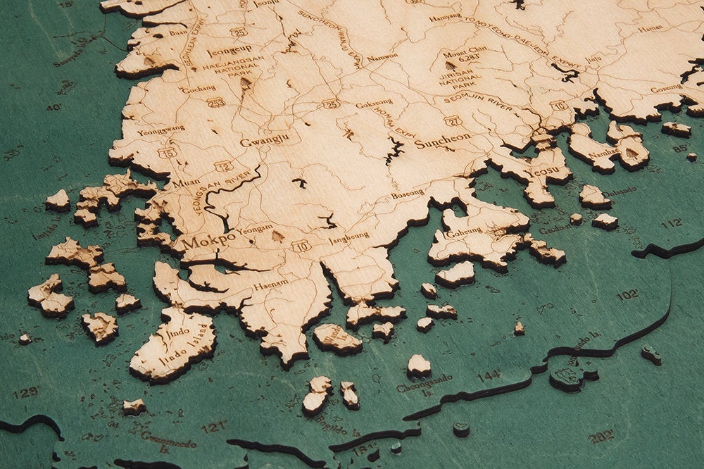 South Korea 3D layered wood map in laser-cut Baltic birch, shown framed against a light wall