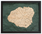 Kauai, Hawaii 3D layered wood map in laser-cut Baltic birch, shown framed against a light wall