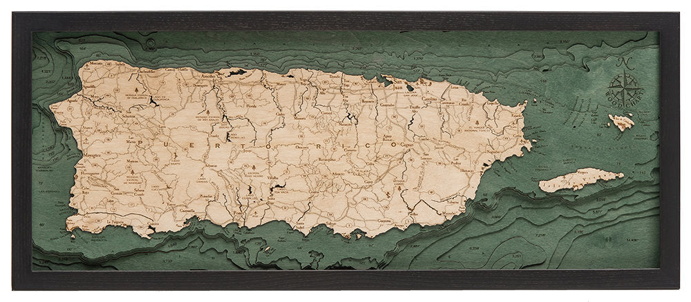Puerto Rico 3D layered wood map in laser-cut Baltic birch, shown framed against a light wall