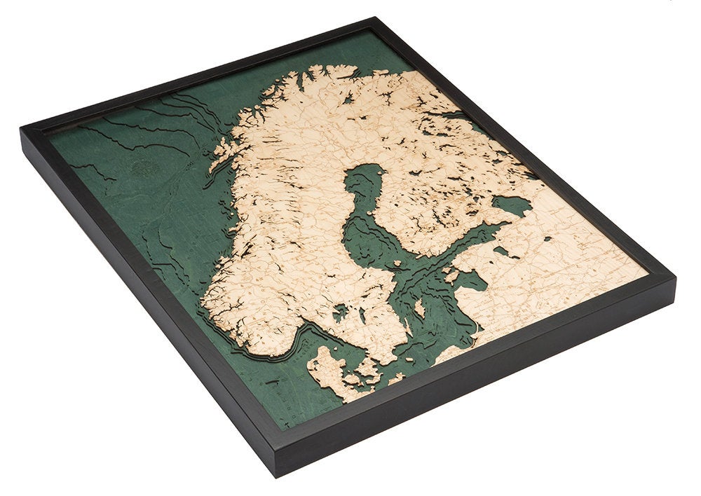 Scandinavia 3D layered wood map in laser-cut Baltic birch, shown framed against a light wall