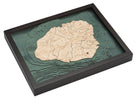 Kauai, Hawaii 3D layered wood map in laser-cut Baltic birch, shown framed against a light wall