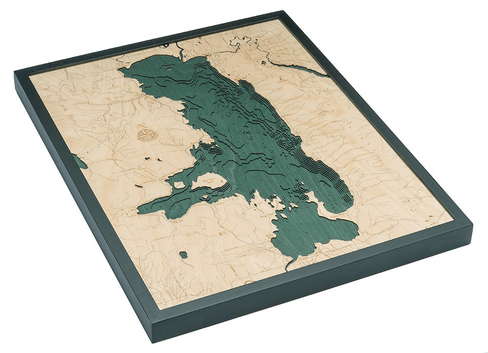 Flathead Lake, Montana 3D layered wood map in laser-cut Baltic birch, shown framed against a light wall