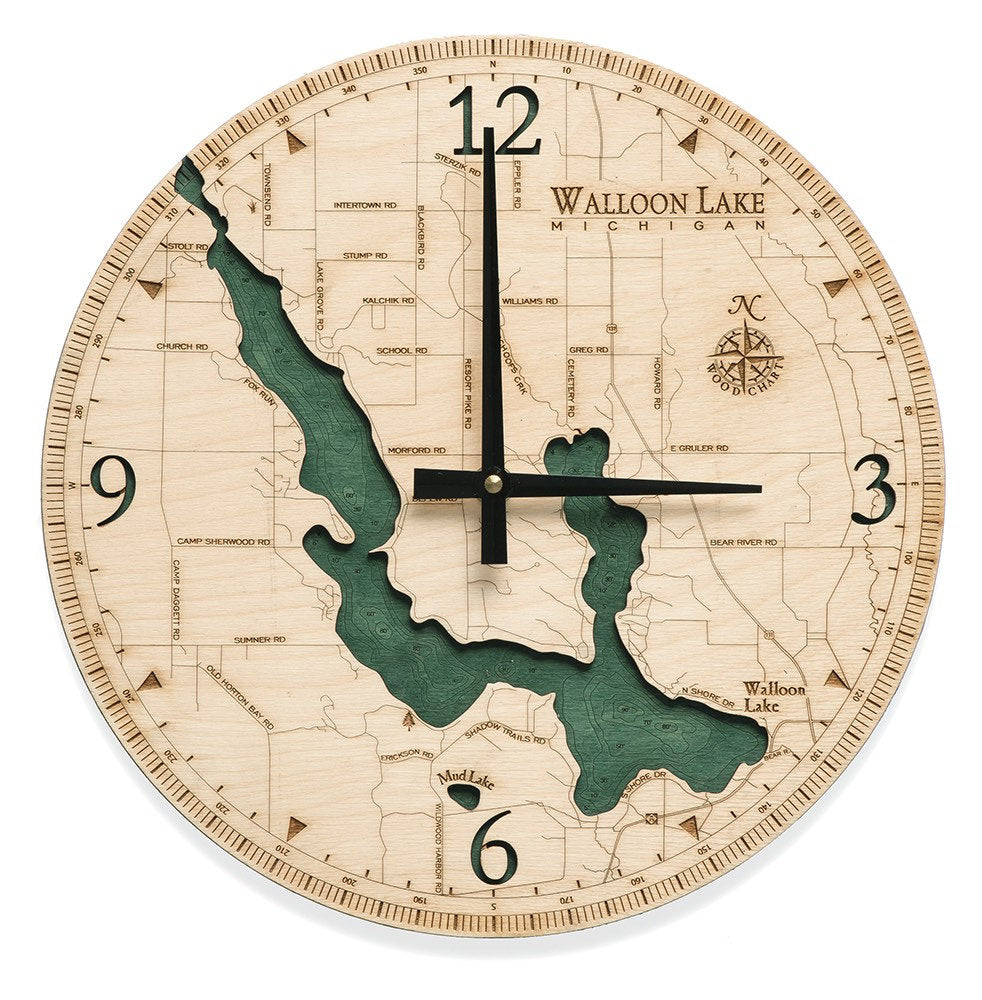 Walloon Lake, Michigan wood wall clock in laser-cut Baltic birch, shown framed against a light wall